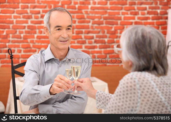 Elderly couple celebrating anniversary