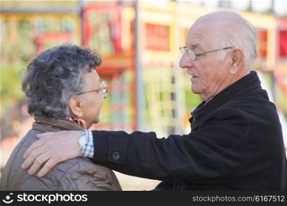 Elderly couple deep in conversation