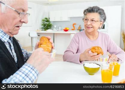 Elderly couple eating a Continental breakfast