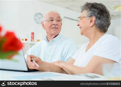 elderly couple having a conversation