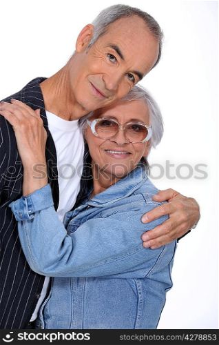 Elderly couple hugging