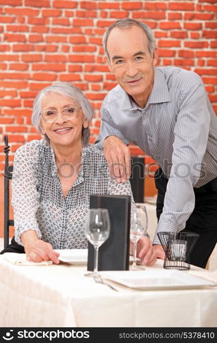 Elderly couple in restaurant