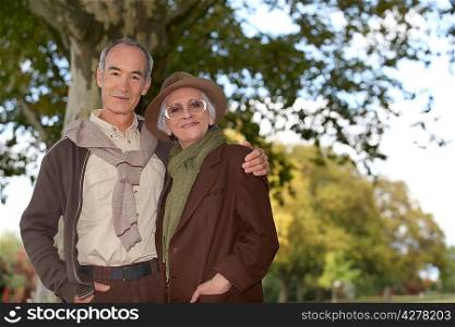 elderly couple in the forest
