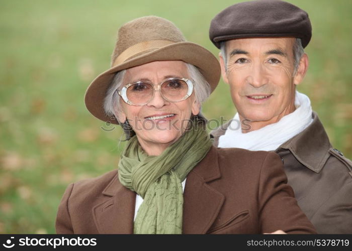 Elderly couple out for a stroll on a Sunday afternoon