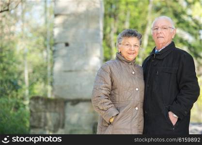 elderly couple posing