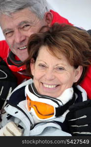 Elderly couple skiing