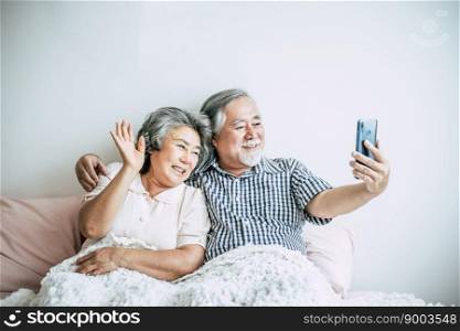 Elderly Couple Using Smartphone