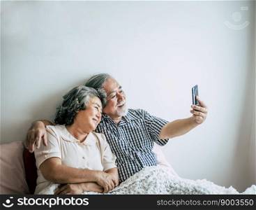 Elderly Couple Using Smartphone