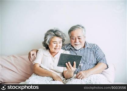 Elderly Couple Using tablet computer