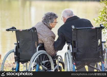 elderly couple whispering