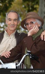 Elderly couple with bicycle