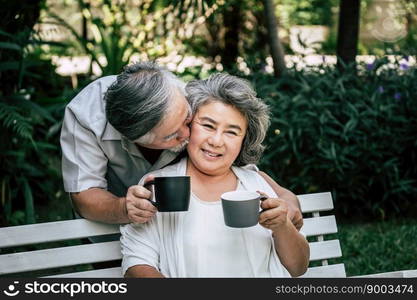 Elderly Couples Playing and eating some fruit