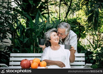 Elderly Couples Playing and eating some fruit