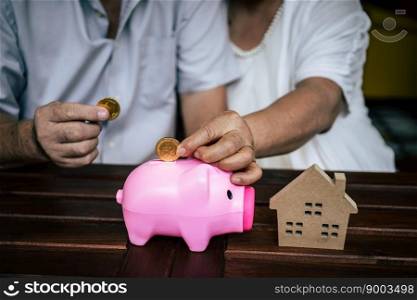 Elderly Couples talking about finance with piggy bank