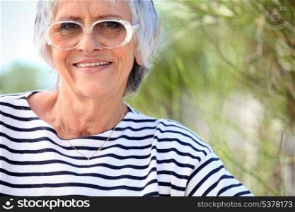 Elderly lady at the beach