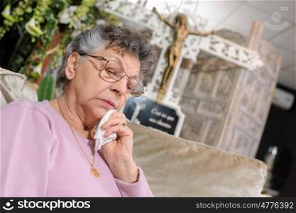 Elderly lady in funeral parlour