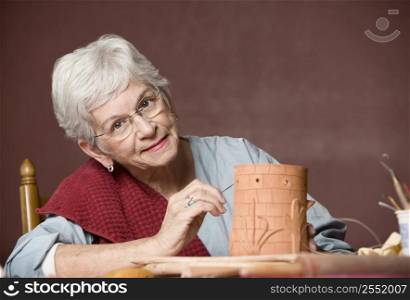 Elderly lady painting