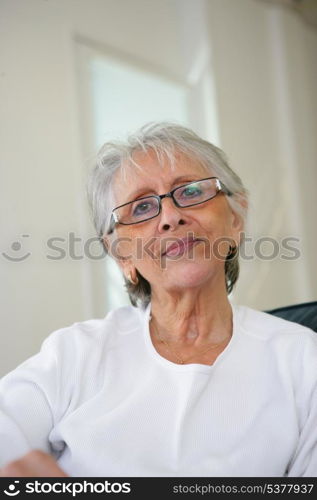 Elderly lady relaxing at home