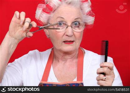 Elderly lady styling own hair