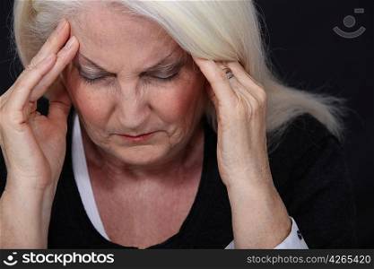 Elderly lady with bad headache