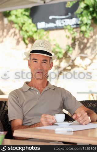 Elderly man drinking coffee
