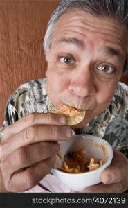 Elderly man eating