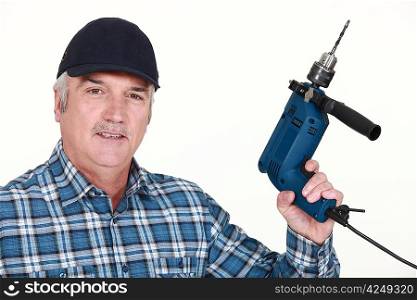 Elderly man holding an electric screwdriver