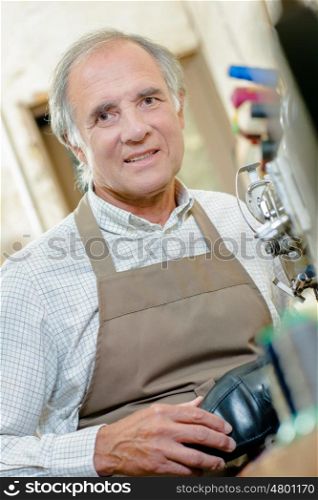 elderly man in apron