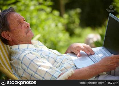 Elderly man on a laptop