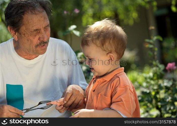 Elderly man playing with a child