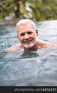 Elderly man swimming