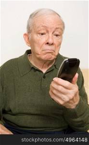 Elderly man with remote control