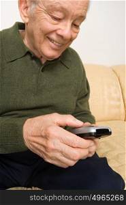 Elderly man with remote control