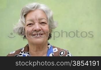 Elderly people and feelings, details of face and eyes of happy senior caucasian woman with white hair looking at camera. Sequence