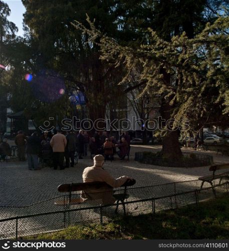 Elderly people gather in town square, Lisbon, Campo de Ourique