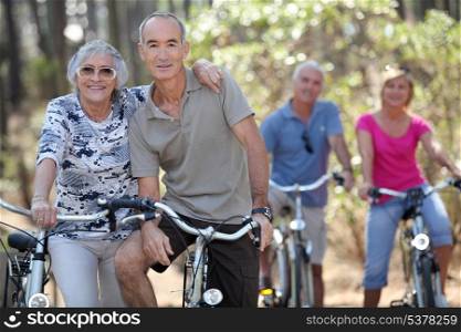 Elderly people riding their bikes