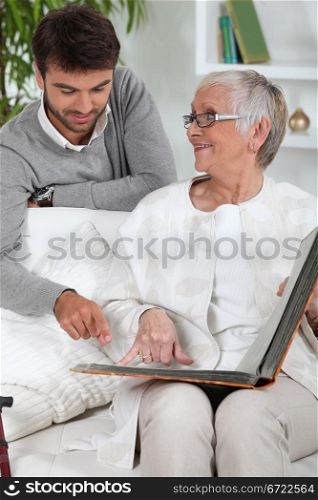 Elderly person looking at photos