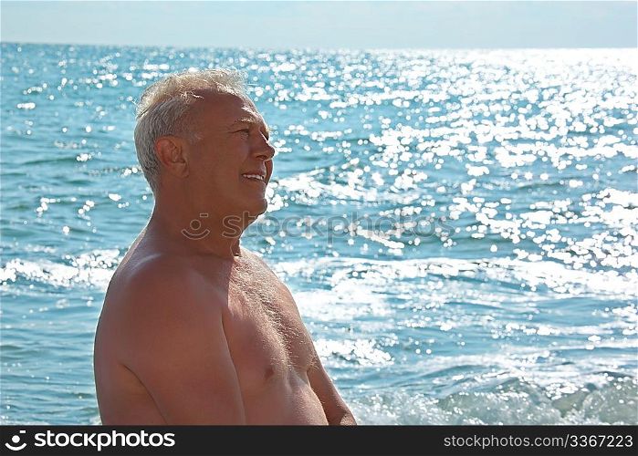 elderly smiling man on seacoast
