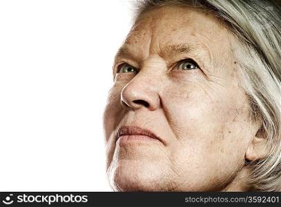 Elderly woman&acute;s portrait. Isolated on white background