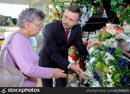 elderly woman choosing a bouquet