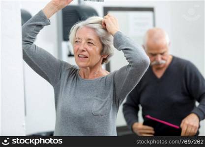 elderly woman combing her hair