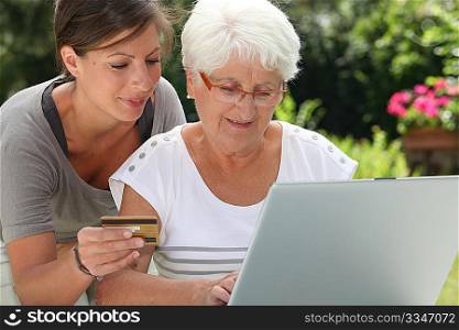 elderly woman doing shopping on internet