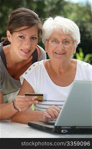 Elderly woman doing shopping on internet
