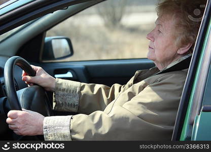 Elderly woman-driver in car