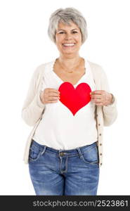 Elderly woman holding a heart shape in her hands, isolated on white background