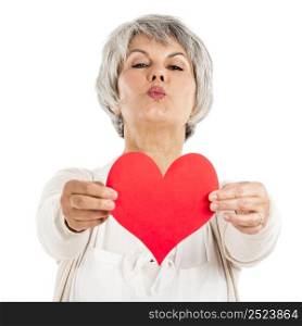 Elderly woman holding a heart shape in her hands, isolated on white background