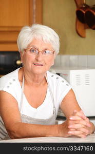 Elderly woman in home kitchen