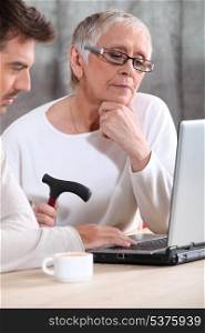 Elderly woman using a computer
