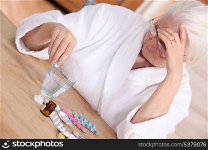 Elderly woman with various medications
