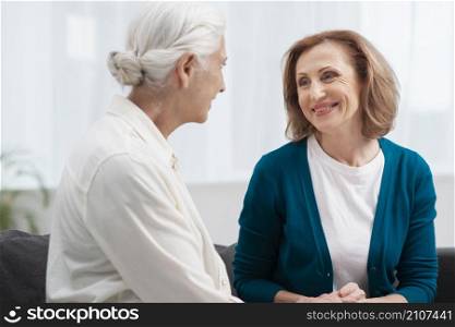 elderly women looking each other